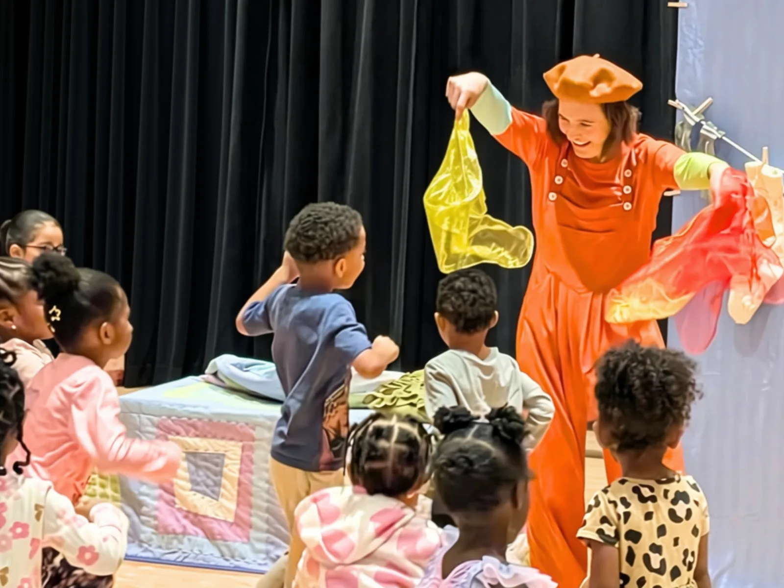 An Artist in Residence performs with children